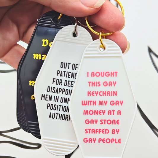 Keychain with humorous text message on a white background